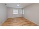 A light-filled bedroom with wood flooring and neutral walls at 20431 Calder Ave, Port Charlotte, FL 33954