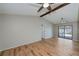 Spacious bedroom with vaulted ceiling, wood beams, ceiling fans and sliding glass doors to the pool area at 20431 Calder Ave, Port Charlotte, FL 33954