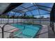 Inviting screened-in pool with clear blue water, perfect for relaxation and outdoor enjoyment at 20431 Calder Ave, Port Charlotte, FL 33954