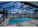 Sparkling private screened-in swimming pool in backyard with ample deck space at 20431 Calder Ave, Port Charlotte, FL 33954