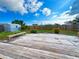 Large backyard with wooden deck and storage shed at 21157 Midway Blvd, Port Charlotte, FL 33952