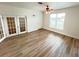 Bright living room with light wood flooring and French doors at 21157 Midway Blvd, Port Charlotte, FL 33952