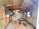 Storage shed interior with shelving and wooden beams at 21157 Midway Blvd, Port Charlotte, FL 33952