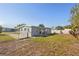 A view of the backyard with a fence that surrounds the property at 21274 Gladis Ave, Port Charlotte, FL 33952