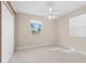 Cozy bedroom with a ceiling fan, closet, and natural light coming through the window at 21274 Gladis Ave, Port Charlotte, FL 33952