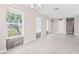 Bright dining room with tile flooring, a modern chandelier, and plenty of natural light at 21274 Gladis Ave, Port Charlotte, FL 33952