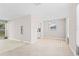 Open dining space featuring tile floors and seamless transition to the living area at 21274 Gladis Ave, Port Charlotte, FL 33952