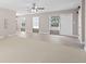 Bright living room with a ceiling fan, tile flooring, and neutral paint at 21274 Gladis Ave, Port Charlotte, FL 33952