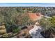 Aerial view of single-Gathering house with an orange tile roof and circular driveway at 21370 Harborside Blvd, Port Charlotte, FL 33952