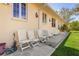 Backyard patio with white chairs and a relaxing view at 21370 Harborside Blvd, Port Charlotte, FL 33952