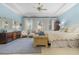 Spacious Primary bedroom with light blue walls and a sitting area at 21370 Harborside Blvd, Port Charlotte, FL 33952