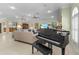 Elegant living room with a grand piano and large windows at 21370 Harborside Blvd, Port Charlotte, FL 33952