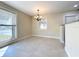 Bright dining area featuring tile flooring, chandelier, and natural light at 21402 Meehan Ave, Port Charlotte, FL 33952