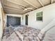 Patio featuring tiled flooring, garage access, and ample natural light at 21402 Meehan Ave, Port Charlotte, FL 33952