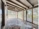 Tiled outdoor patio with lattice screen, and a view of the garage and a side entrance at 21402 Meehan Ave, Port Charlotte, FL 33952