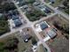 Aerial view of property featuring a screened pool and storage shed at 2275 Logsdon St, North Port, FL 34287