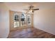 Bedroom with lots of natural light from three large windows and luxury vinyl flooring at 2275 Logsdon St, North Port, FL 34287