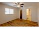 Bedroom with ceiling fan, a window that provides natural light, and wood-look flooring at 2275 Logsdon St, North Port, FL 34287