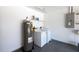 Utility area in garage featuring a water heater and a washing machine at 2275 Logsdon St, North Port, FL 34287