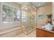 Bathroom with large glass shower and built-in bench at 24248 Treasure Island Blvd, Punta Gorda, FL 33955