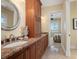 Bright bathroom with double vanity and access to a bedroom at 24248 Treasure Island Blvd, Punta Gorda, FL 33955