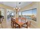 Bright dining room with water views and access to patio at 24248 Treasure Island Blvd, Punta Gorda, FL 33955