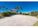 Large gravel driveway providing ample parking space at 24248 Treasure Island Blvd, Punta Gorda, FL 33955