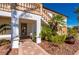 Elegant entryway with a custom door and stone walkway at 24248 Treasure Island Blvd, Punta Gorda, FL 33955