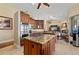 Open kitchen with island, gas cooktop, and custom cabinetry at 24248 Treasure Island Blvd, Punta Gorda, FL 33955