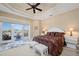 Bright main bedroom with water views and sitting area at 24248 Treasure Island Blvd, Punta Gorda, FL 33955