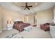 Spacious main bedroom with carpeted floors and sitting area at 24248 Treasure Island Blvd, Punta Gorda, FL 33955