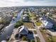 Expansive aerial view showcasing waterfront homes along canals with ocean access at 24343 Pirate Harbor Blvd, Punta Gorda, FL 33955