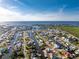 Aerial view of waterfront homes on canals with direct access to the ocean at 24343 Pirate Harbor Blvd, Punta Gorda, FL 33955