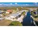 Aerial shot showcases the waterfront community with direct canal access, private docks, and lush landscaping at 24343 Pirate Harbor Blvd, Punta Gorda, FL 33955