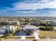 Enjoy the view of this two-story home with a metal roof and mature landscaping at 24343 Pirate Harbor Blvd, Punta Gorda, FL 33955