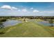 View of the golf course and lake from an aerial perspective at 24343 Pirate Harbor Blvd, Punta Gorda, FL 33955