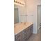 Bathroom with vanity, sink, and shower at 26376 Nadir Rd # 301, Punta Gorda, FL 33983