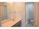 Bathroom with double vanity and shower at 26376 Nadir Rd # 301, Punta Gorda, FL 33983