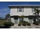 Front view of a townhouse with landscaping at 26376 Nadir Rd # 301, Punta Gorda, FL 33983