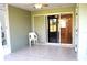 Patio with sliding glass doors and chair at 26376 Nadir Rd # 301, Punta Gorda, FL 33983