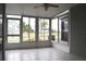 Sunroom with tiled floor and golf course view at 26376 Nadir Rd # 301, Punta Gorda, FL 33983