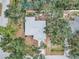 Single-story home surrounded by lush trees at 2771 Siesta Dr, Venice, FL 34293