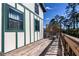 Wooden deck with seating and lattice screen at 28094 Chinquapin Dr, Punta Gorda, FL 33955