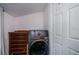 Laundry room with washer, dryer, and storage at 28094 Chinquapin Dr, Punta Gorda, FL 33955