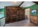 Upstairs hallway with barn doors and view of bathroom at 28094 Chinquapin Dr, Punta Gorda, FL 33955