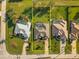 Aerial view showing a large backyard, pool, and neighboring properties in a well-planned community at 290 Rotonda E Blvd, Rotonda West, FL 33947