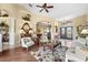 Spacious living room showcases an open floor plan with a seamless transition into the dining and kitchen areas at 290 Rotonda E Blvd, Rotonda West, FL 33947