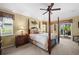 Inviting main bedroom with a four-poster bed, soft lighting, and a peaceful ambiance at 290 Rotonda E Blvd, Rotonda West, FL 33947