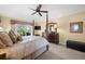 Serene main bedroom showcasing a spacious layout, backyard views, and elegant furnishings at 290 Rotonda E Blvd, Rotonda West, FL 33947