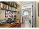 Home office with desk, shelving, and a view into the laundry room with washer and dryer at 290 Rotonda E Blvd, Rotonda West, FL 33947